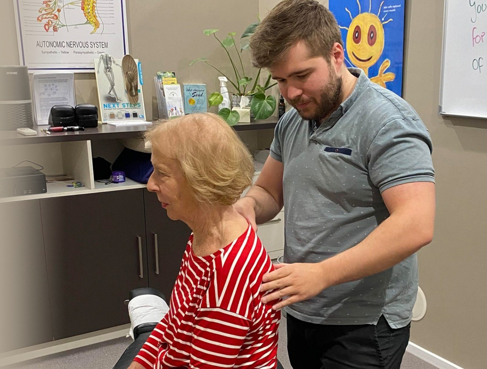 Dr Matt checking a patient's posture