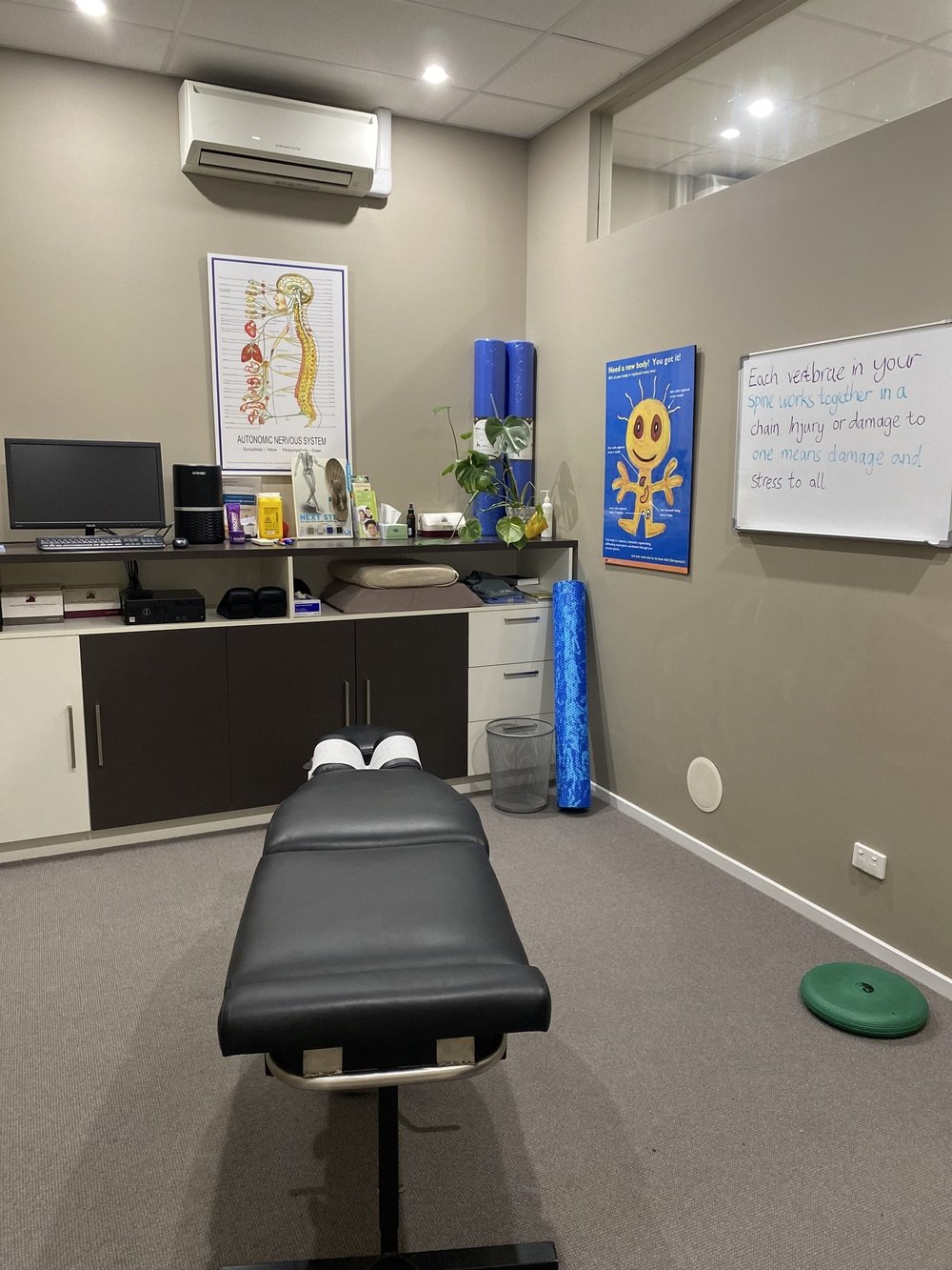 A treatment room with the adjusting table