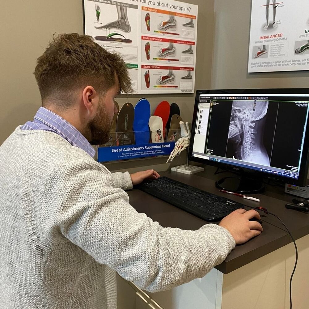 Dr Matt going over a neck X-ray on screen